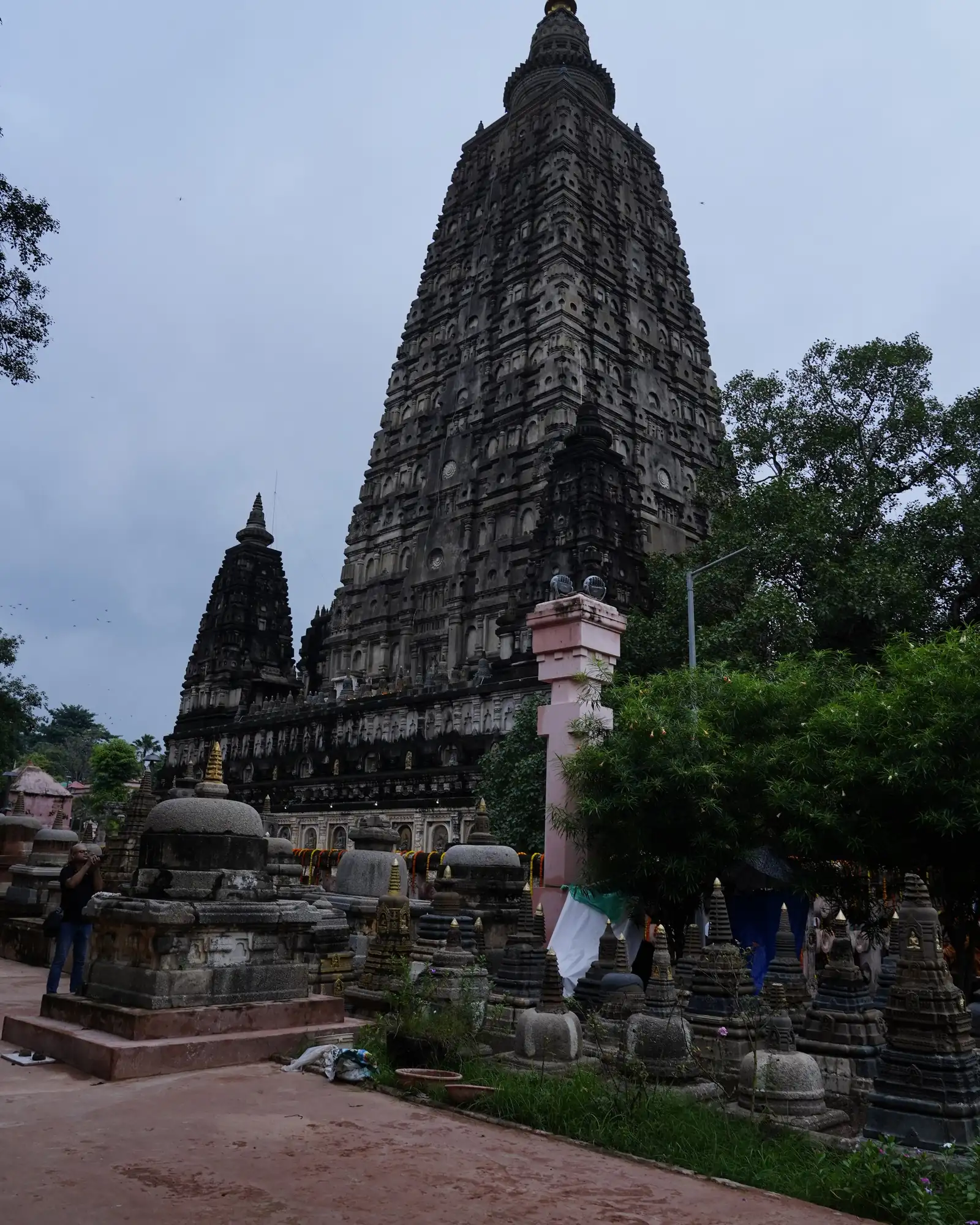 The Mahabodhi Temple tower seen above small votive stupas in the temple courtyard, Bodh Gaya
